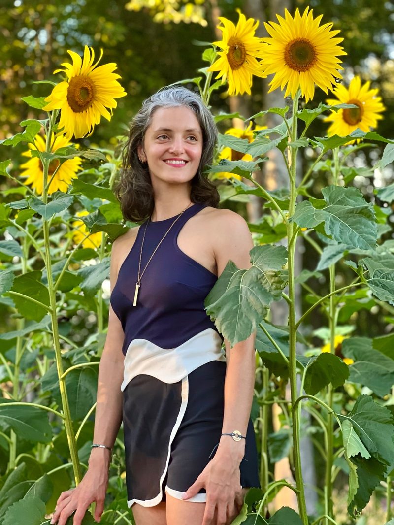 Sofia-Jeanne among sunflowers